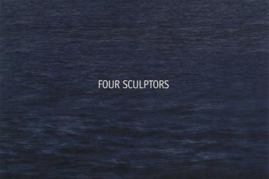 Four Sculptors text over ocean water